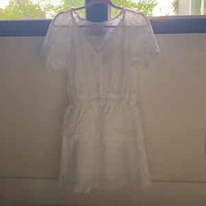 selling white  dress with embroidered floral print. perfect for summer getaway!